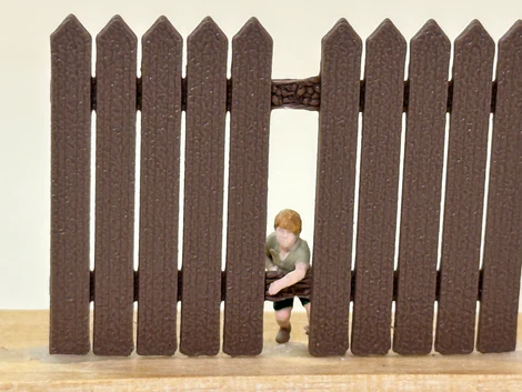 boy figure with fence