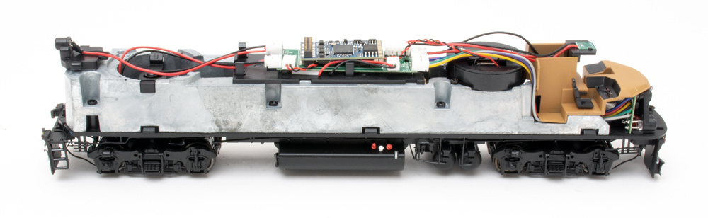 Color photo showing mechanism of HO scale diesel locomotive.