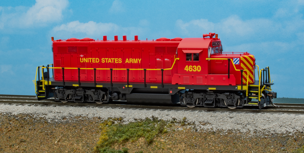 Color photo of HO scale diesel on scenic base.