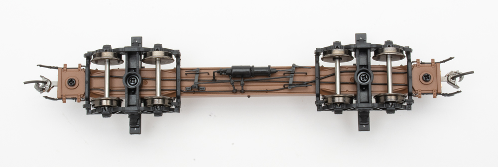 Color photo showing underbody of HO scale log car.