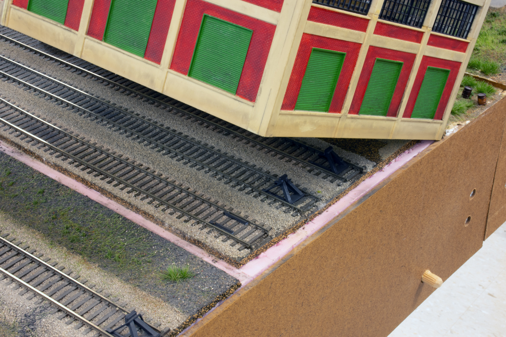 Color photo showing building, track, and layout.