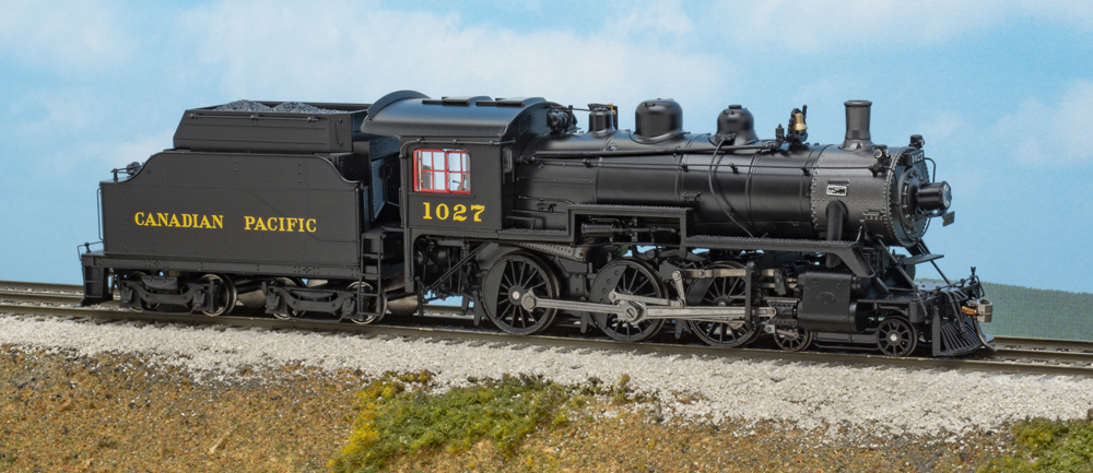 Color photo of HO scale steam locomotive on scenic base.