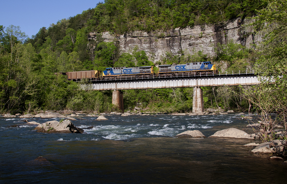 trains on bridge above water