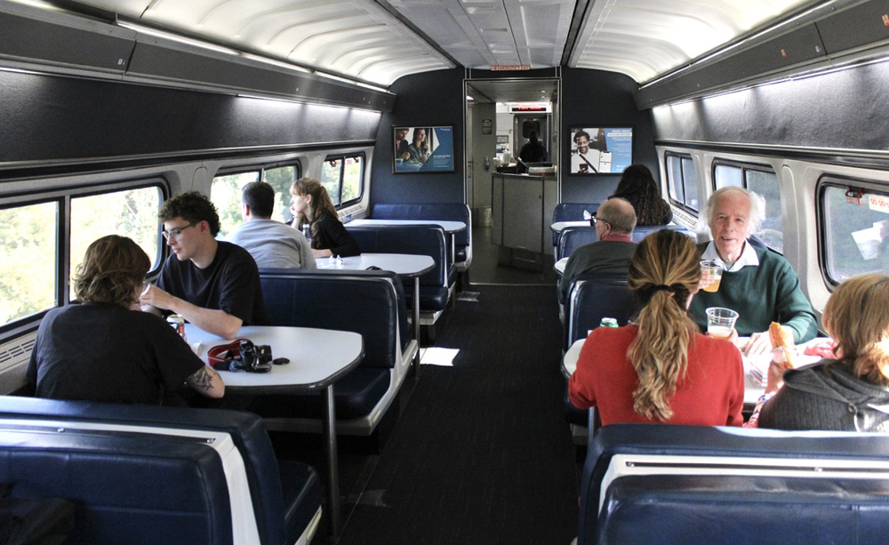 View of tabled seating area inside passenger car