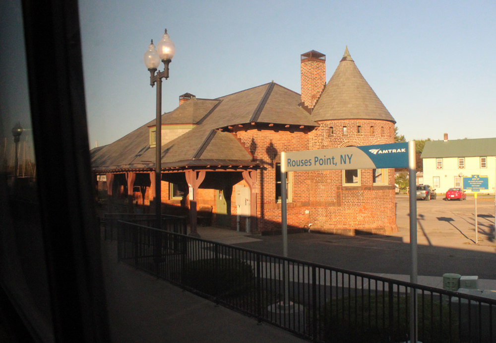 Brick train station as seen from train window