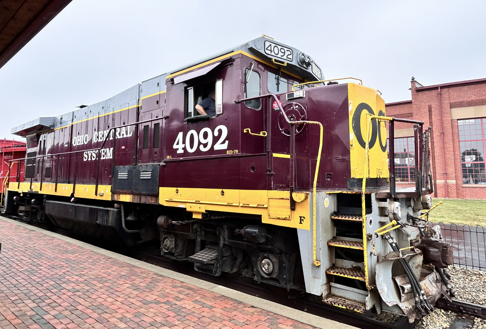 Maroon locomotive with yellow and gray trim