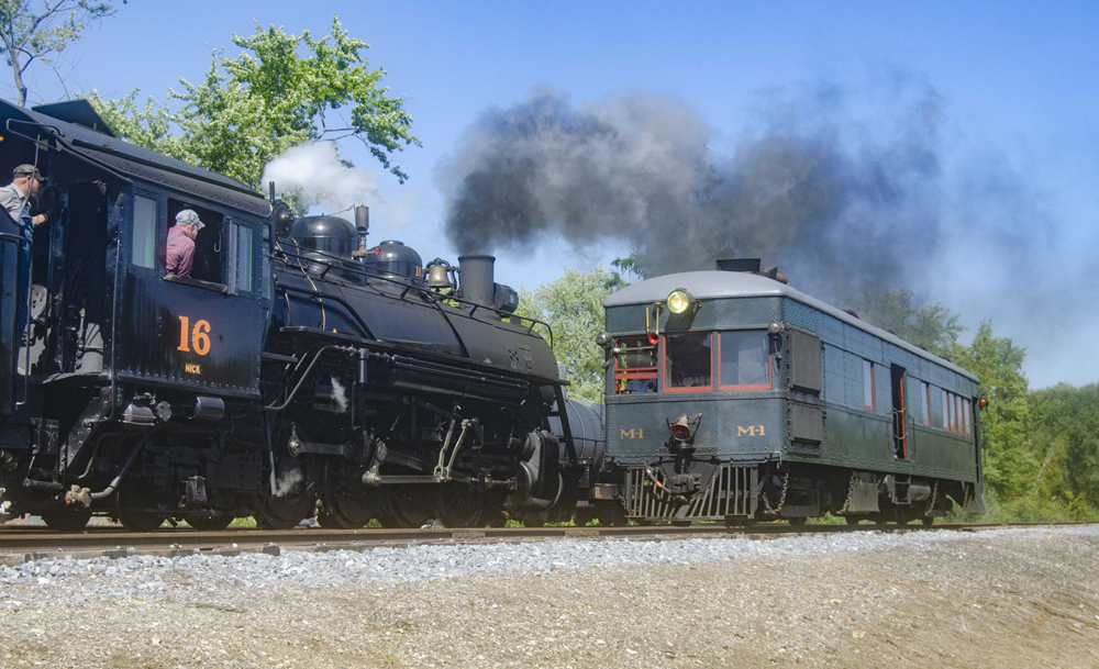 Gas-electric car meets train with steam engine