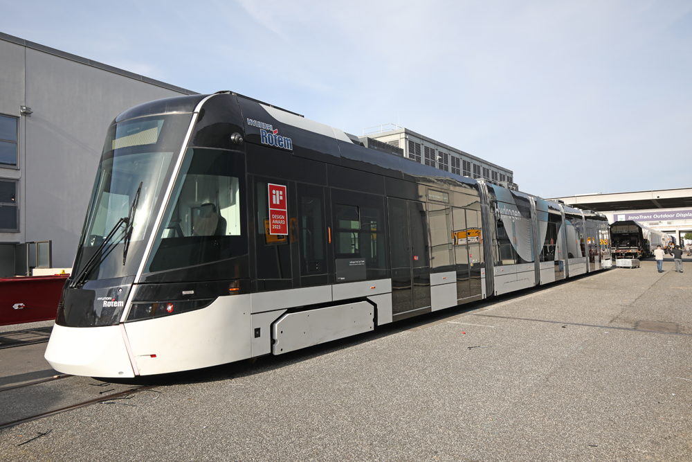 Gray and white light rail trainset