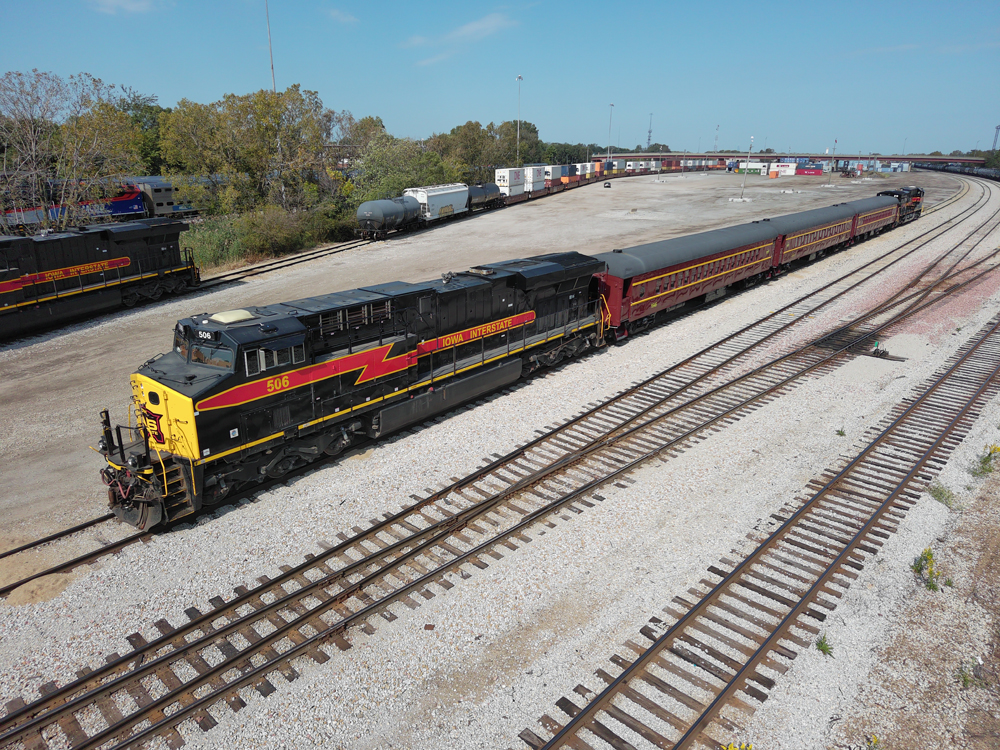 Passenger train with three cars and locomotive at each end