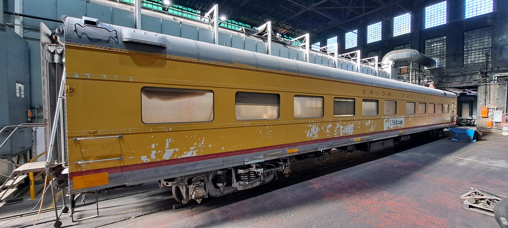 Yellow passenger car in shop building