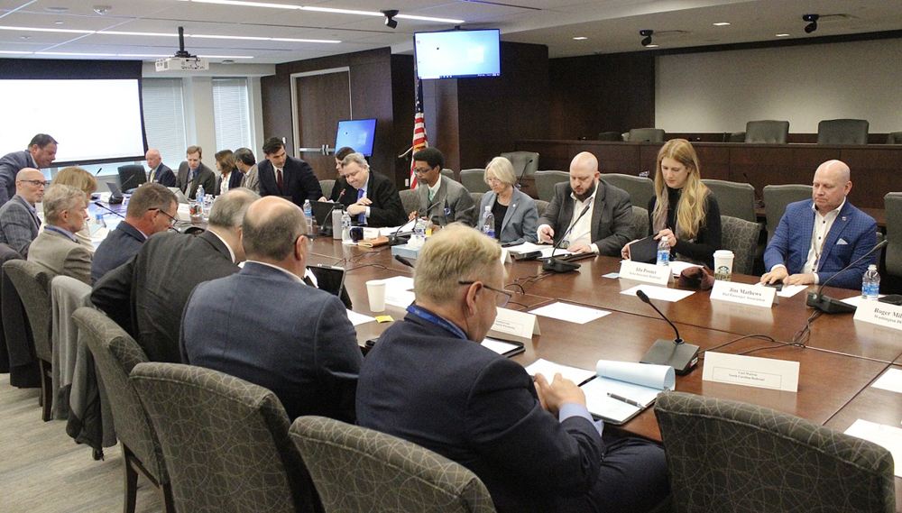 Large group of people around conference table