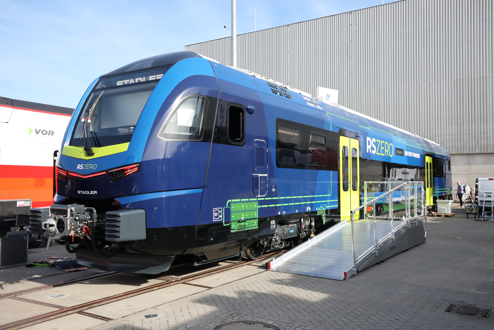 Cab car of regional train in several shades of blue