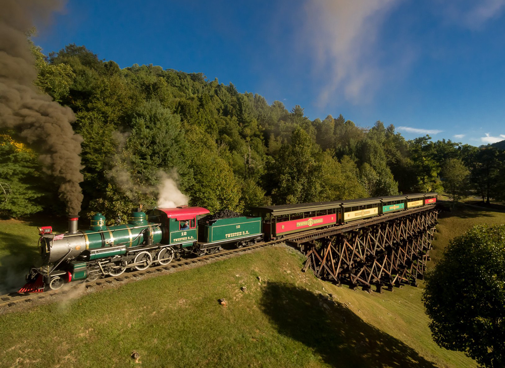 Steam locomotive with open-air passenger cars