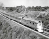 Streamlined Burlington Route diesel locomotives on curve with passenger train