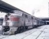 Streamlined Burlington Route diesel locomotives in station with passenger train