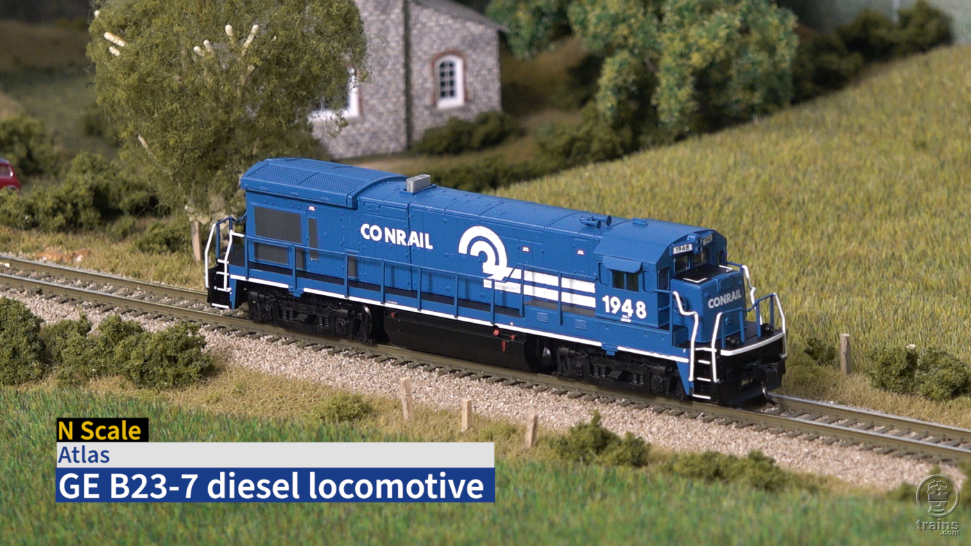 Title screen of product review video with N scale diesel locomotive on model railroad.