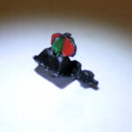 Black painted switch stand with red and green flags