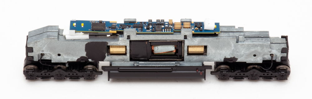 Photo showing split-frame mechanism on N scale diesel.