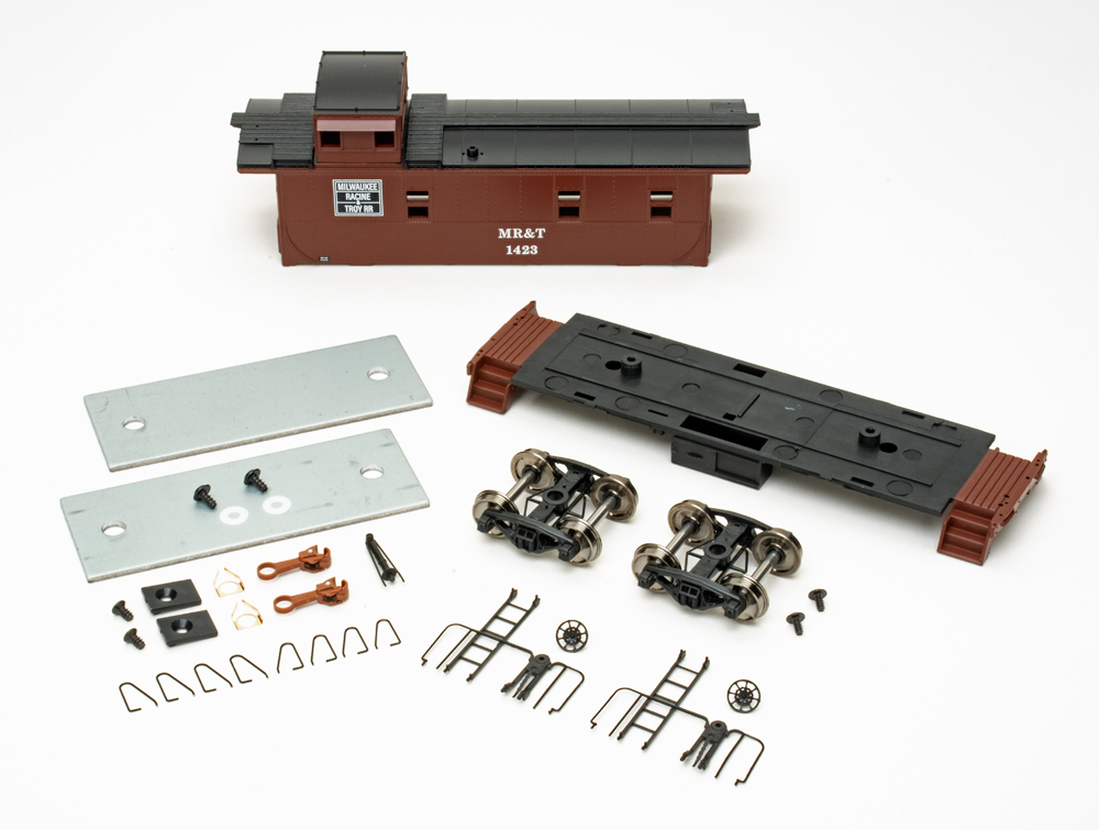 Color photo showing HO scale caboose kit components. 