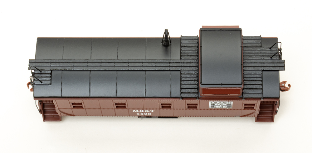 Roof view of HO scale caboose painted brown and black on white background.