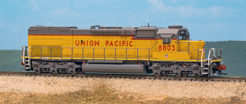 Color photo of N scale diesel locomotive on scenic base.