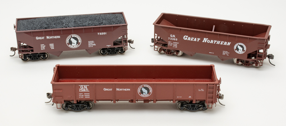 Color photo of three HO scale freight cars.