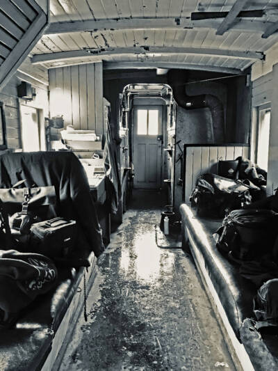 Black & white photo of caboose interior