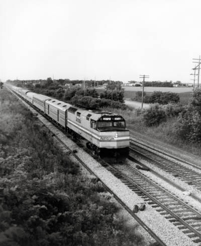 Black and white photo of a diesel powered passenger train. Illinois Central. They call him Bear.