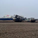 Derailed cars in field