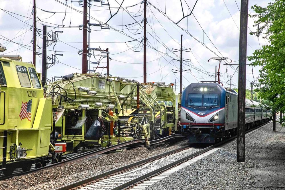 Passenger train passing track maintenance equipment