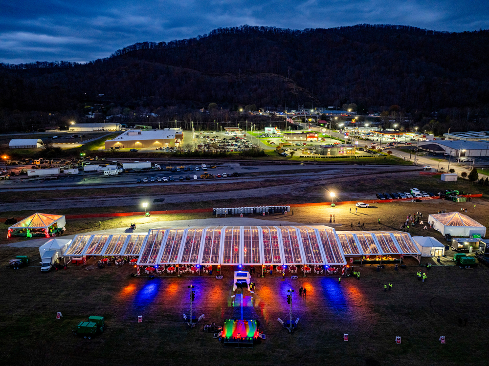 Drone photo of tent with tables at rail yard