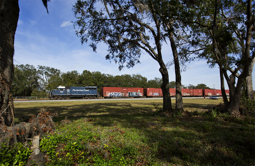 Blue locomotive with boxcars