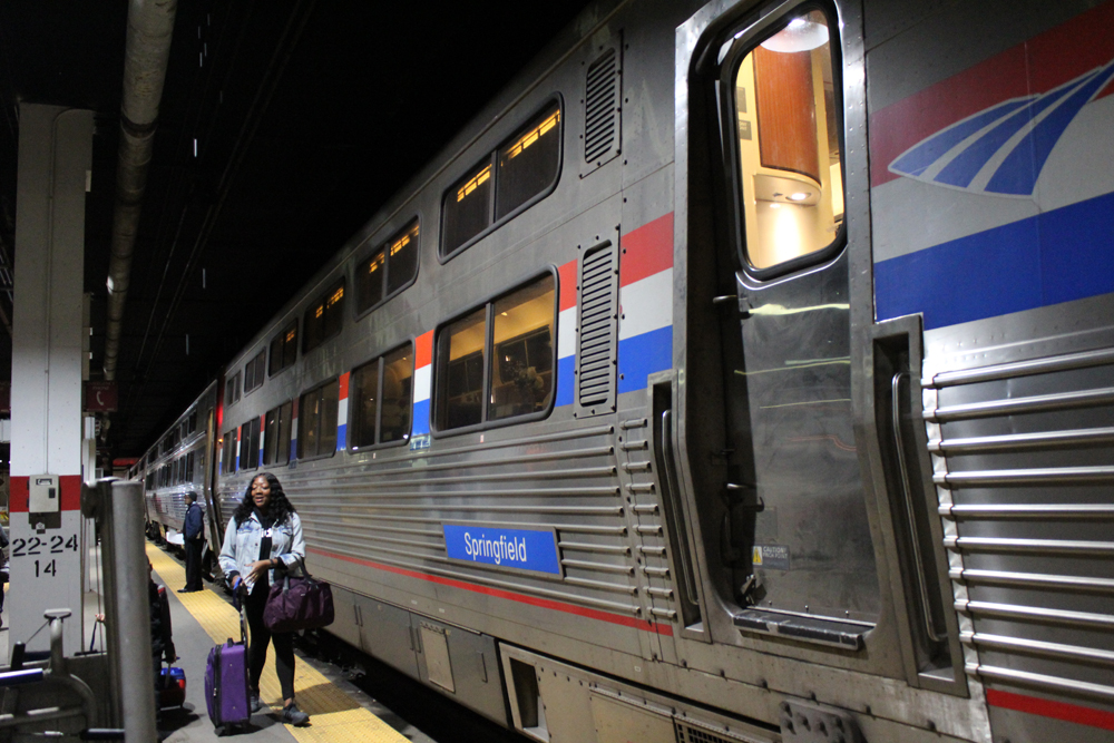 Passenger walks past dining car at station