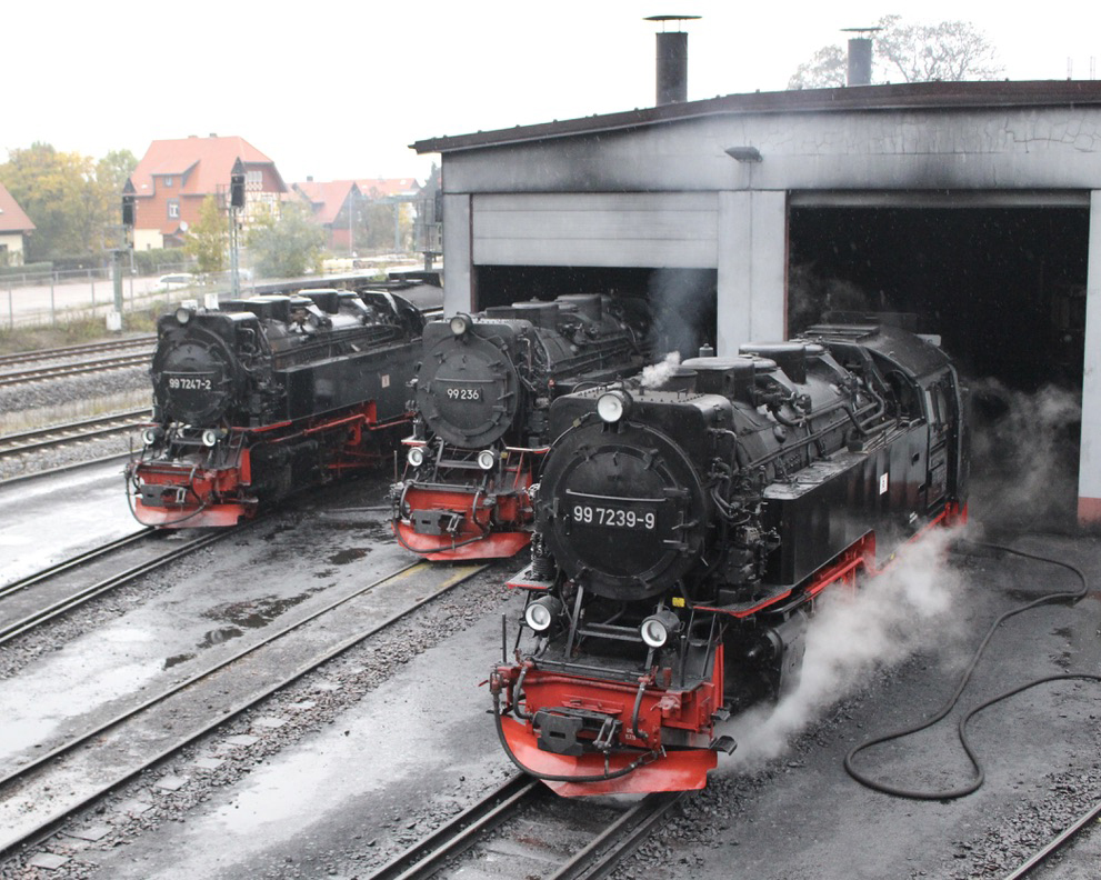 Three steam engines at shop building