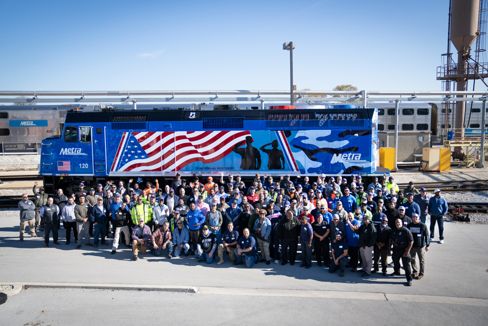 Locomotive with group of people