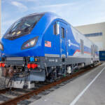 Three-quarters view of blue and silver passenger locomotive