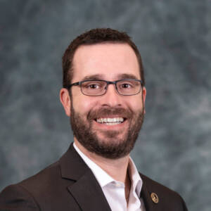 Head shot of with glasses and beard 