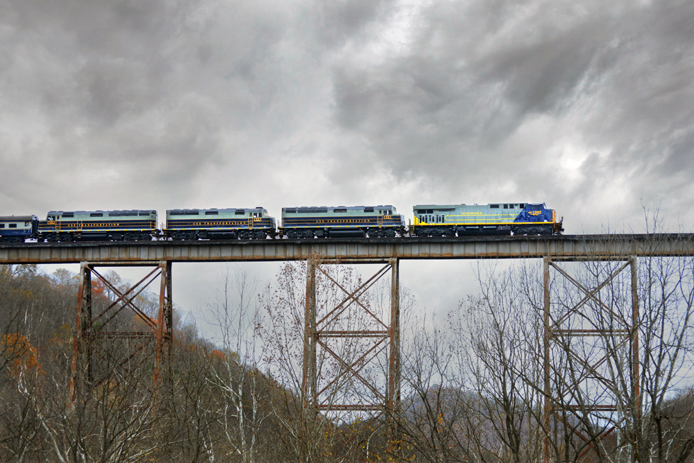 Train with four locomotives on long trestle