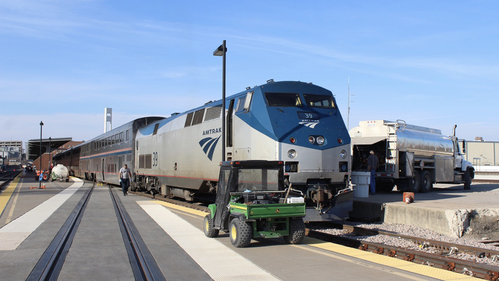 Locomotive of passenger train is refueled at station