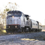 Passenger train with road-switcher style locomotive in lead