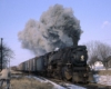 Smoking Grand Trunk Western steam locomotive in snow