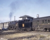 Grand Trunk Western steam locomotive with passenger train in city