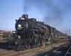 Grand Trunk Western steam locomotive with passenger train in city