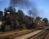 Smoking Grand Trunk Western steam locomotive with passenger train at speed 