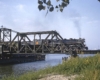 Grand Trunk Western steam locomotive with train on bridge