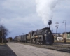 Streamlined Grand Trunk Western steam locomotive with passenger train at station