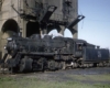 Grand Trunk Western steam locomotive beneath concrete coaling tower