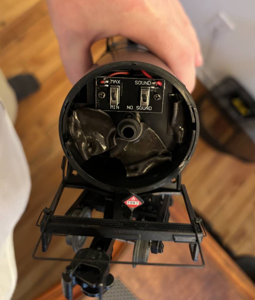 side of model tank car with potentiometer