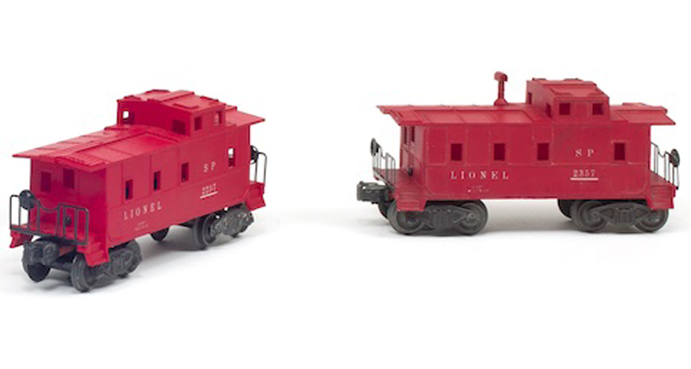 Two red toy train cabooses