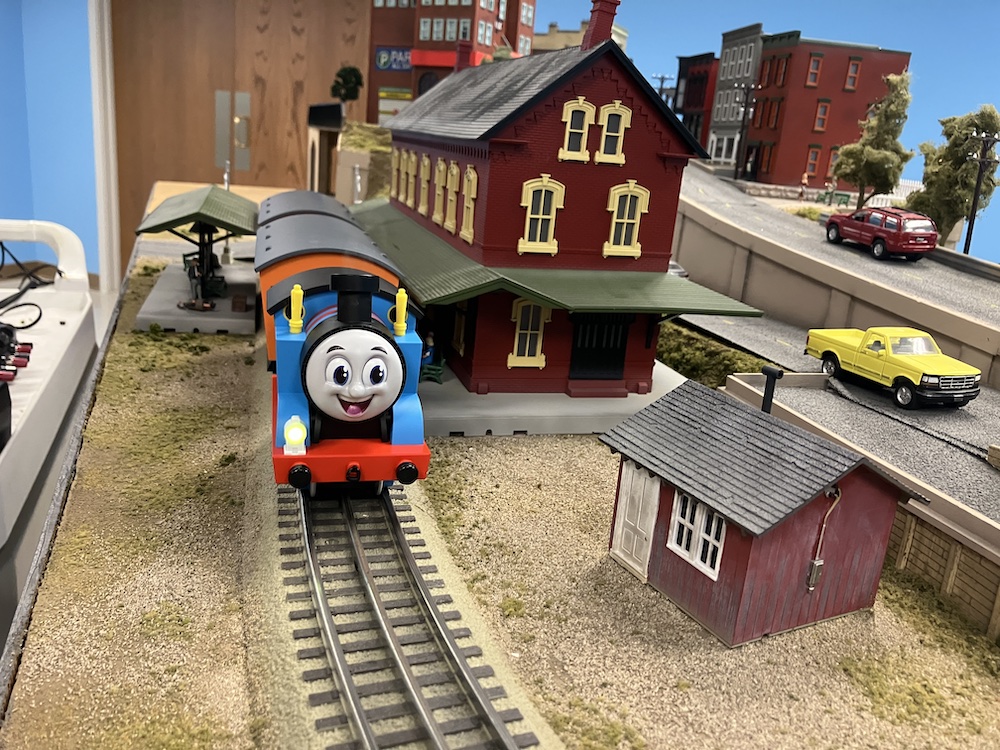 smiling model train on layout; Lionel Thomas and Friends Battery Operated Train set